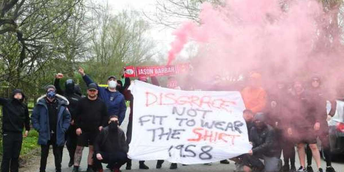 Manchester United fans protesting against Glazers at the club's Carrington training facility.